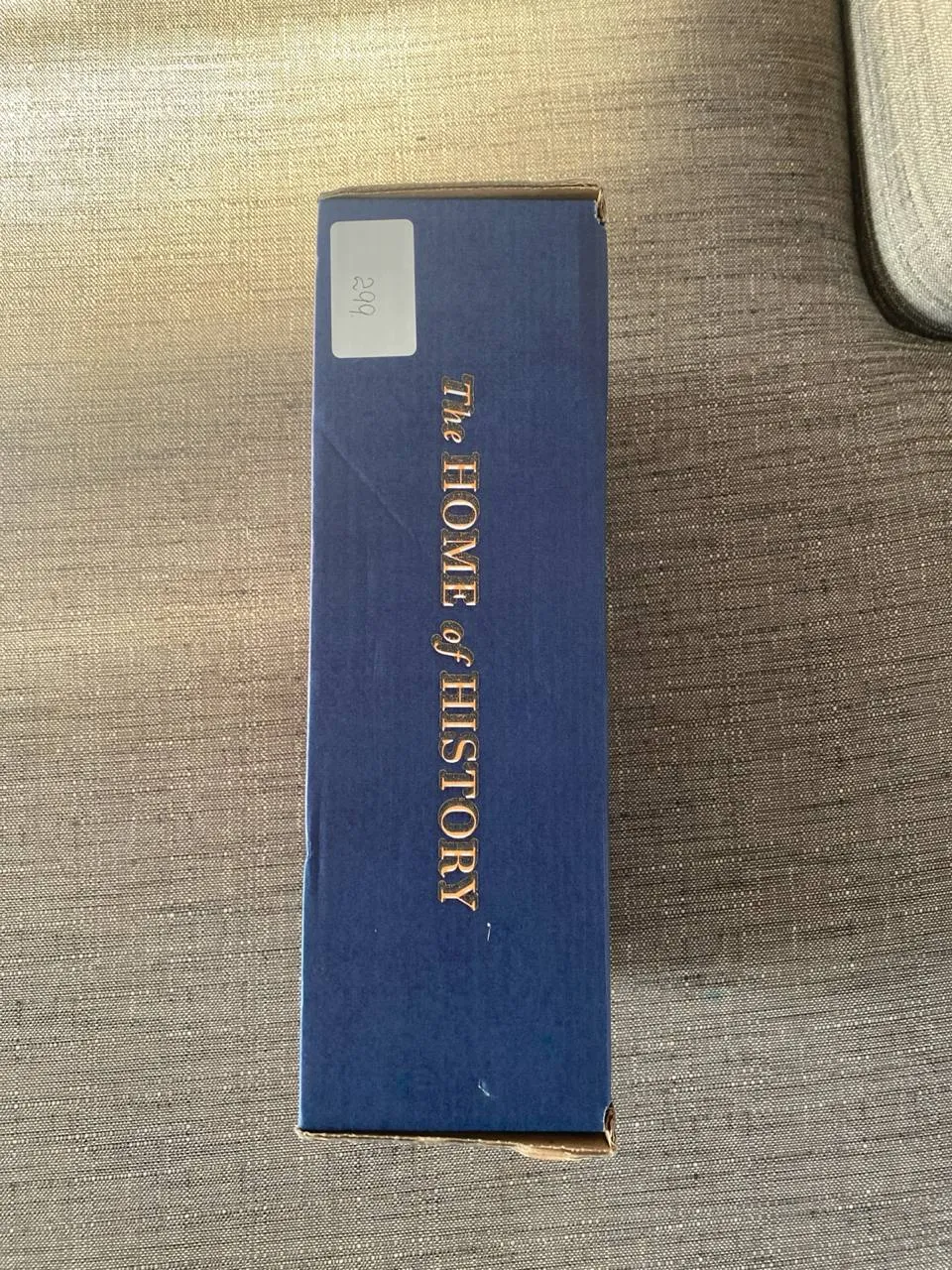 side of the box with 'The Home of History' in gold letters